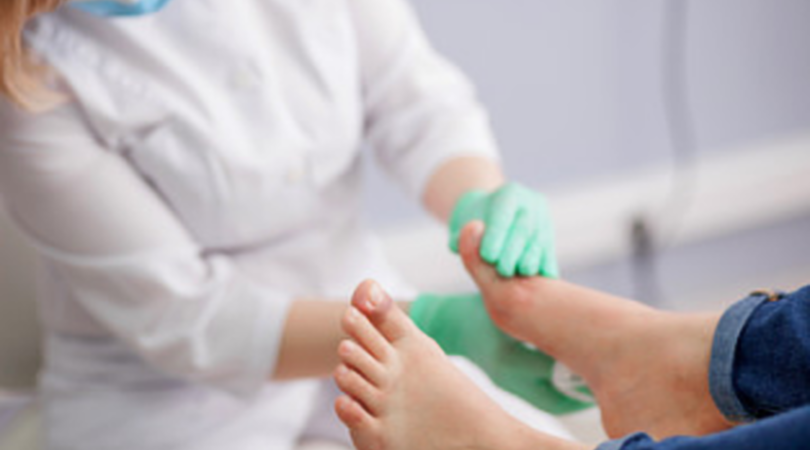 doctor checking diabetic foot